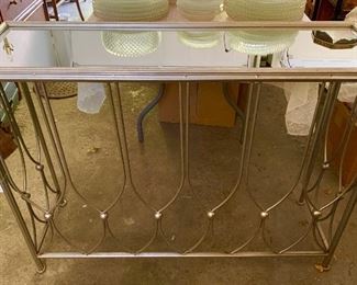 Sliver mirrored table.