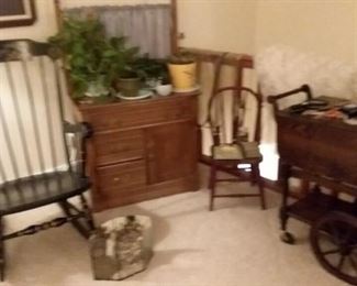 Vintage rocking chair; wood tea cart; silk plants; pottery; child’s chair; dry sink cabinet