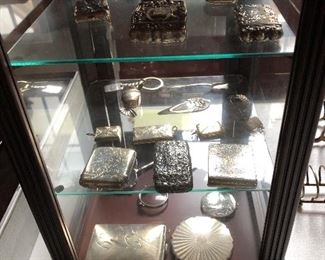 Sterling collection of vesta cases, lorgnettes, and other pieces.