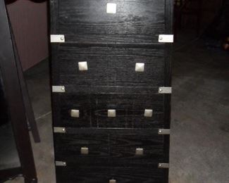 Black chest of drawers.