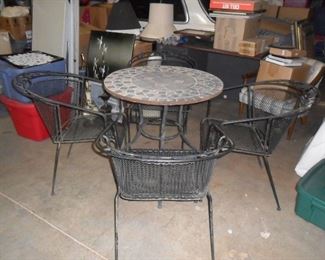 Wrought iron chairs with mosaic table