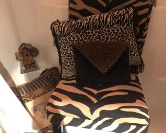 Animal Print Chair, pillows, gold bath mat