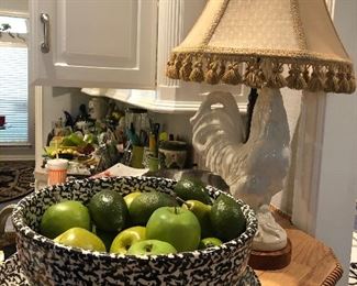 Faux green apples in pottery bowl