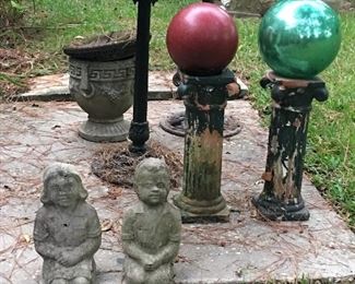 All sorts of outdoor items - the red ball is actually a bowling ball (not making that up) - boy and girl are fully clothed