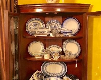 Mahogany corner cupboard filled with Flo-Blue china of all shapes