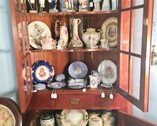 One of two Cherry corner cupboards filled with treasures - many handpainted and several 19th C.
