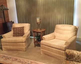 Matching upholstered club chairs.