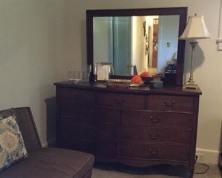Mahogany bow front dresser and mirror.