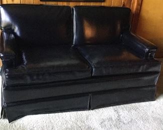 Small Naugahyde love seat.