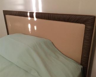 Padded upholstered headboard, bed frame and mattress.