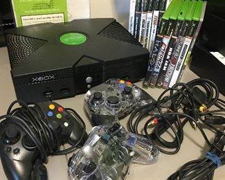 XBOX 360 with 3 controllers, 13 games (6 games are still factory sealed) and power cord.