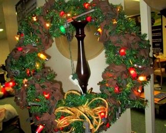 Peace through strength holiday wreath with light up shot gun shells