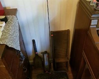 Scattered about are some old farm items
