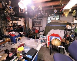 Lots of Chicago-centric and other metal signs, vintage perfume bottles, vintage standing globe, tons of small collectibles and knick knacks. That black case at the bottom is an antique optometrist (eye doctor) kit.