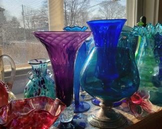 Pairpoint and other artisan blown glass vases and bowls.
