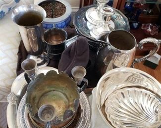 Silver and silver plated serving platters, bowls, candlesticks, pitcher