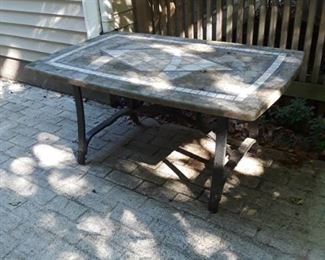 Patio table with stone/tile top. 