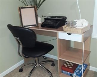 Small desk, office chair, vintage typewriter.