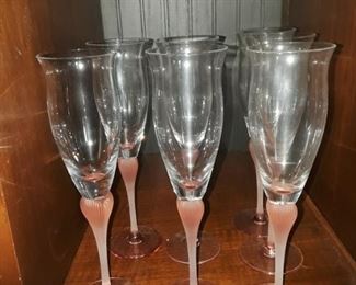 Champagne glasses, pink stems. 