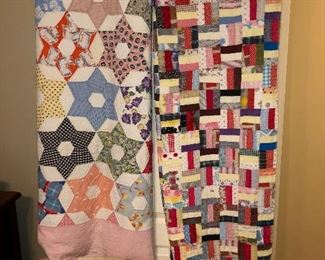Several antique quilts