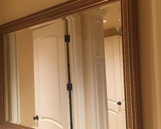 Framed beveled gold mirror