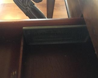 Carved detail of chair and desk manufacturer (Hemingway Collection)