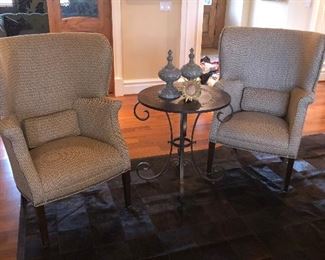 Pair of wing back chairs and round metal side table