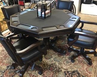 Great poker table with four chairs . Two chairs need repair to the arms