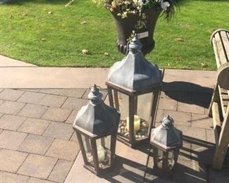 Three outdoor lanterns (sold individually) large urn with fall plantings
