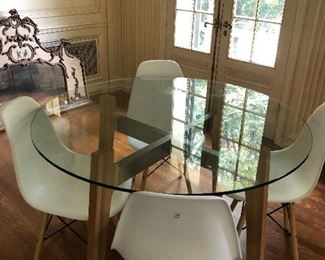 CB2 Brace dining table base with a 47" round glass top and four chairs asking $490 for the set