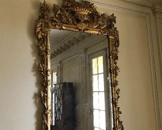 A pair of Louis XVI style Giltwood Mirrors 20th Century  Each mirror measures 58" high x 31.5" wide The estimated value is $8000-12,000  Asking $4600