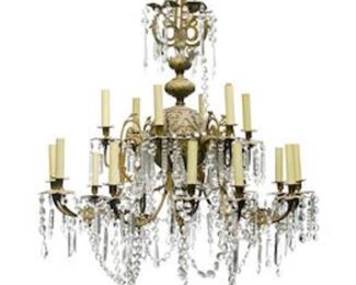 A French gilt metal and glass eighteen light chandelier.  Crated and ready to move.  50"tall by 36" diameter.  Valued at $3000 - $5000. asking $2000