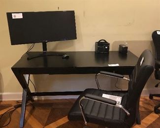 Black finish three drawer work desk with a choice of two desk chairs and large LG monitor for sale model number   Monitor is an LG 34UM68P asking $140.  Desk measures 58"w x 28"d x 31"h and asking $80
