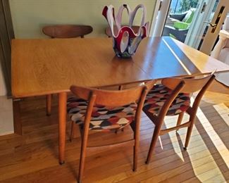 Hans J. Wegner-DENMARK..Table has leaves underneath that UNFOLD to create a large dining room set. THIS EXACT set is on 1rst Dibs for $20,000!!! But not HERE!