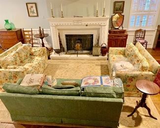 Another living room filled with antiques and collectibles