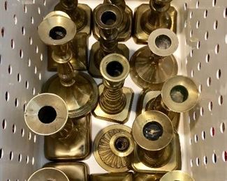 Brass candlesticks all shapes and sizes