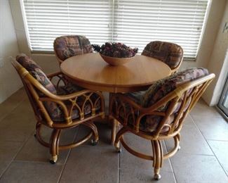 Dinette/Game table, Center pedestal, 4 Cane chairs on castors, removable cushions
