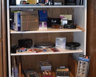 Binoculars, Kodak Camera, Viewer, Minolta Camera, Calculators, VHS DVD Players, Hitachi Transitor Radio
