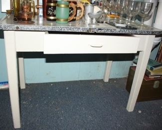 1930's farm house kitchen baking table.  Wonderful condition.  Could be fun computer desk also.  Tin top porcelain. 