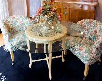 glass table and barrel chairs