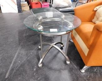 Contemporary brushed steel table with glass top 
