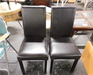 (2) Espresso vinyl padded chairs 