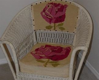 One of two vintage wicker chairs