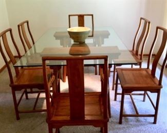 Solid wood/glass Dining table with six chairs. Workmanship is incredible. The wood is either take or a walnut and the grain is beautiful. $1250.00 firm.