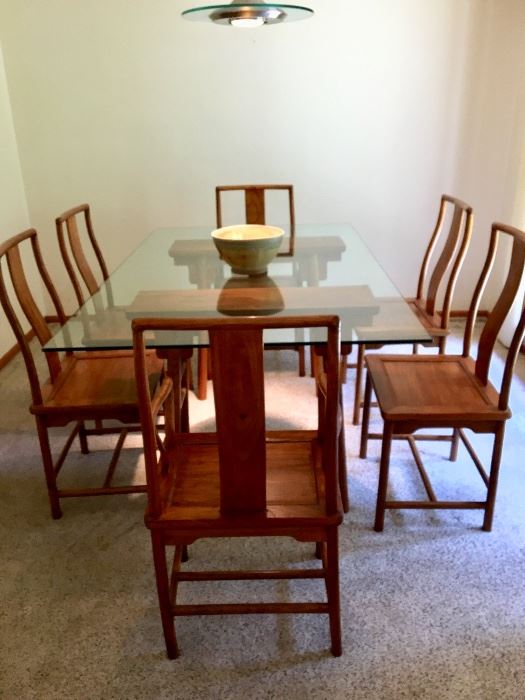 Solid wood/glass Dining table with six chairs. Workmanship is incredible. The wood is either take or a walnut and the grain is beautiful. $1250.00 firm.