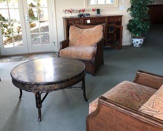 Chairs in soft sepia tones and paisley cushions