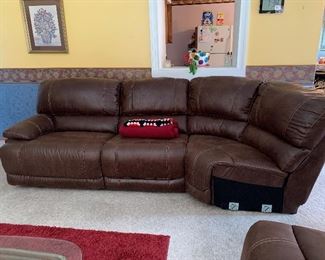  Large leather sectional couch with built-in recliner’s 