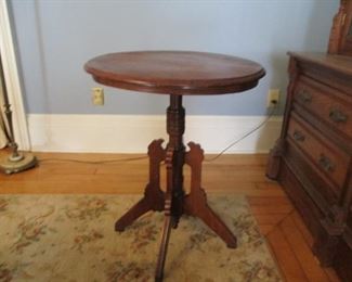 Antique Walnut Round Parlor Table. Rough Dimensions: 24.5 in. radius x 30 in. tall.