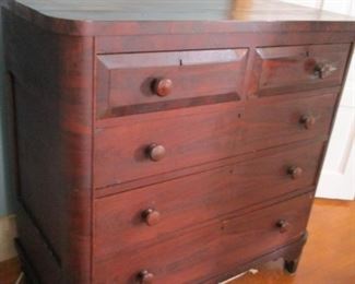 Antique Empire Style Chest of Drawers found in St. Louis, Missouri. Condition is nearly excellent.  All drawers are functional.  The drawer pulls have wooden threading.  