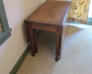 Antique Walnut Gate Leg Table shown with both leaves down.   